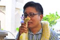 Man kiss an albino snake