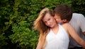 Man kiss sly girl in cheek Royalty Free Stock Photo