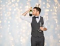 Man kissing bottle of champagne at christmas party Royalty Free Stock Photo
