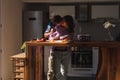 Man kissing his girlfriend`s neck while making the salad Royalty Free Stock Photo