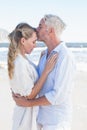 Man kissing his partner on the forehead at the beach Royalty Free Stock Photo