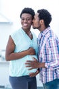 Man kissing his pregnant wife Royalty Free Stock Photo