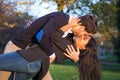 Man kissing passionatly his wife in park