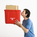 Man kissing recycling bin. Royalty Free Stock Photo