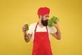 Man on kitchen. healthy eating and dieting concept. cook hold fresh blended salad smoothie bottle. organic eco vegan Royalty Free Stock Photo