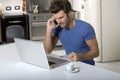 Man in the kitchen with laptop Royalty Free Stock Photo