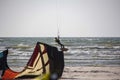 Man Kiteboarding and Jumping on a Kite Board