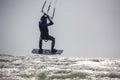 Man Kiteboarding and Jumping on a Kite Board