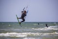 Man Kiteboarding and Jumping on a Kite Board