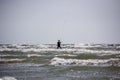 Man Kiteboarding and Jumping on a Kite Board