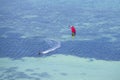 Man kitesurfing in ocean, extreme summer sport on island Koh Phangan, Thailand Royalty Free Stock Photo