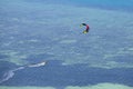 Man kitesurfing in ocean, extreme summer sport on island Koh Phangan, Thailand Royalty Free Stock Photo