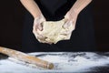 Man kneading pizza dough. The concept of baking and pastry Royalty Free Stock Photo