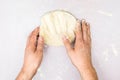 The man kneads the dough
