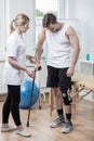 Man with knee orthosis Royalty Free Stock Photo