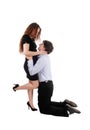 Man kneeling in front of his girlfriend Royalty Free Stock Photo