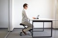 Man on kneeling stool - correct sitting position