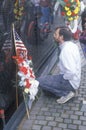 Man Kneeling at Vietnam Wall Memorial, Washington, D.C. Royalty Free Stock Photo