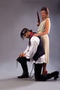 Man kneeling woman musket