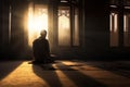 the man kneels in quiet and praying by the window