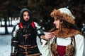 Man knight in armor and woman in historical costume