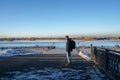 Man with knitted hat and winter jacket walk the street in Irkutsk of Russia