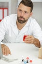 Man lab assistant checks computer results Royalty Free Stock Photo