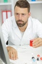 Man lab assistant conducts experiments on pc Royalty Free Stock Photo