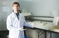 Man in lab coat at dairy production process