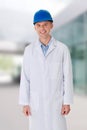 Man in a lab coat and helmet Royalty Free Stock Photo