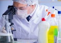 Man in the lab testing new cleaning solution detergent Royalty Free Stock Photo