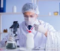 Man in the lab testing new cleaning solution detergent Royalty Free Stock Photo