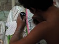 MAN LABELING MEMORIAL ON TABLET