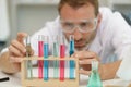 man in laboratory checking test tubes Royalty Free Stock Photo