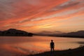 Man on the lake at sunset