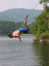 Man on a lake swing Royalty Free Stock Photo