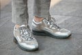 Man with Lanvin silver and beige sneakers before Emporio Armani fashion show, Milan Fashion Week street style