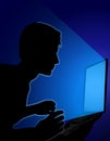 Man on Laptop Blue Glow In Darkness Royalty Free Stock Photo