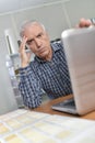 Man with laptop looking troubled Royalty Free Stock Photo