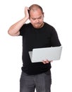 Man with laptop and scratch his head Royalty Free Stock Photo