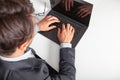 Man with laptop typing on the keyboard. On white table.. Royalty Free Stock Photo