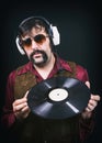 1970`s Retro Man Holding Vinyl Record Music Album