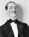 Man laughing and a monocle Royalty Free Stock Photo