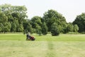 A man on a lawn mower will remove the grass