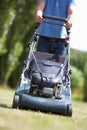 Man with lawnmower Royalty Free Stock Photo