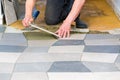 Man laying floor tiles Royalty Free Stock Photo