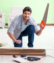 Man laying flooring at home Royalty Free Stock Photo