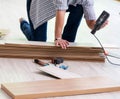 Man laying flooring at home Royalty Free Stock Photo