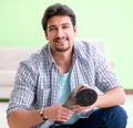 Man laying flooring at home