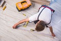 The man laying laminate flooring in construction concept Royalty Free Stock Photo